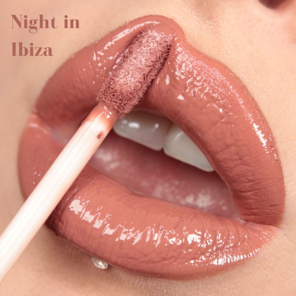 Lipstick application on lips with 'Night in Ibiza' text