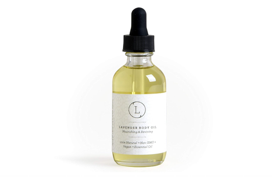 Bottle of lavender baby oil with a dropper on a white background