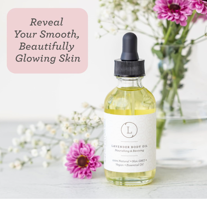 Bottle of lavender body oil with flowers on a light background
