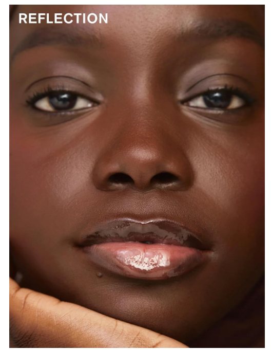 Close-up of a person's face with a hand on their cheek, text 'REFLECTION' above.