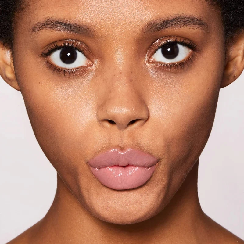 Close-up of a woman's face with a neutral background