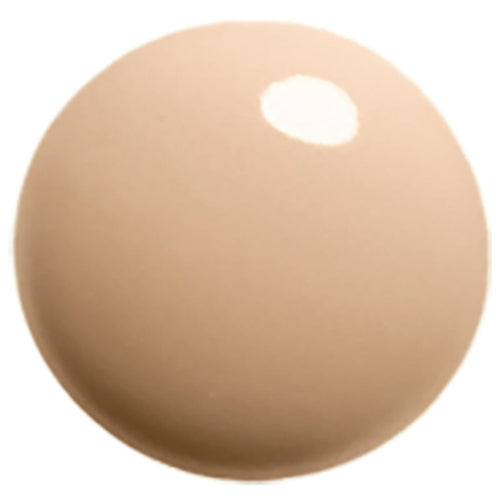 Round beige object with a white center on a white background