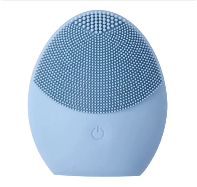 Blue silicone facial cleansing brush on a white background