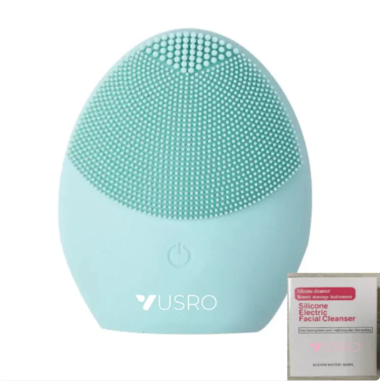 Mint green silicone facial cleanser with USRO branding on a white background