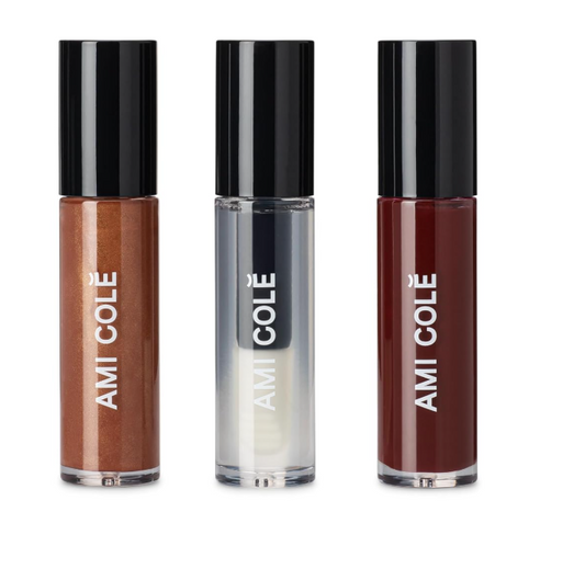 Three lip glosses from Ami Cole on a white background