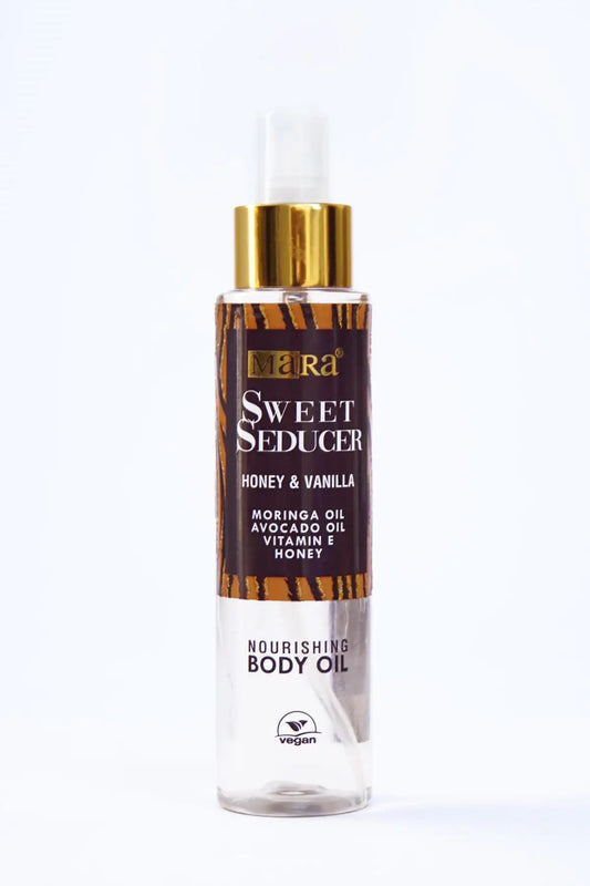 Body oil bottle labeled 'Sweet Seducer' with gold cap on a white background