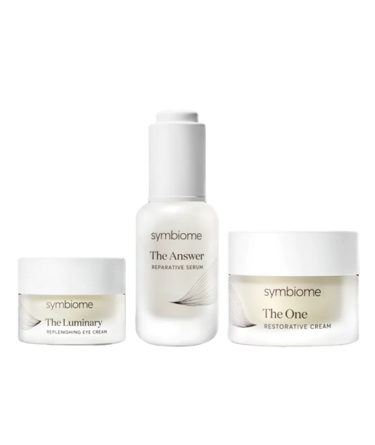 Three skincare products from the brand 'symbiome' on a white background