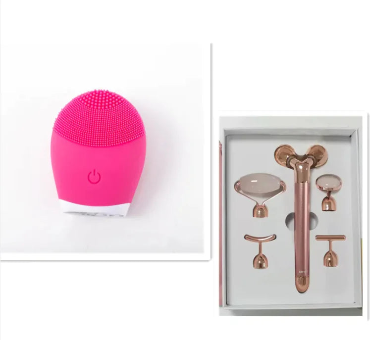 Pink facial cleansing brush and rose gold facial tools in a box on a white background